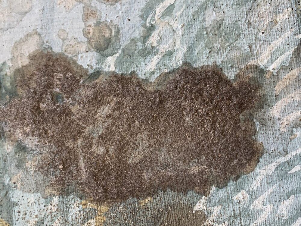 Surface dirt on a canvas painting