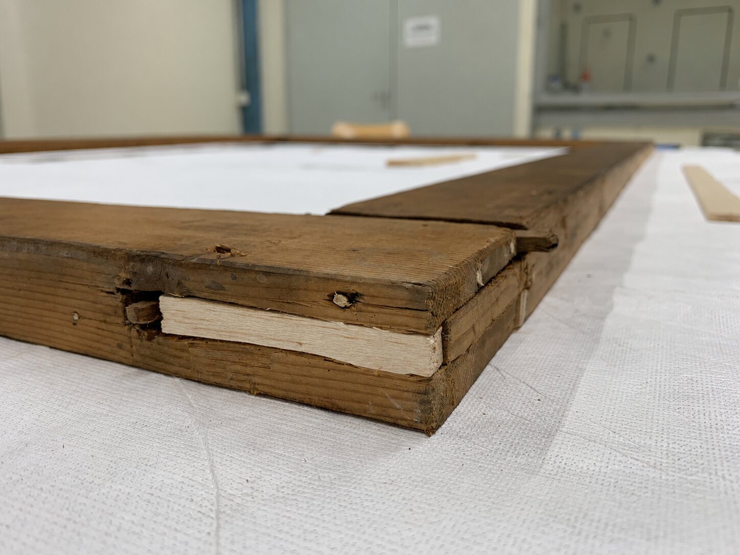 Structural repair to a wooden frame corner